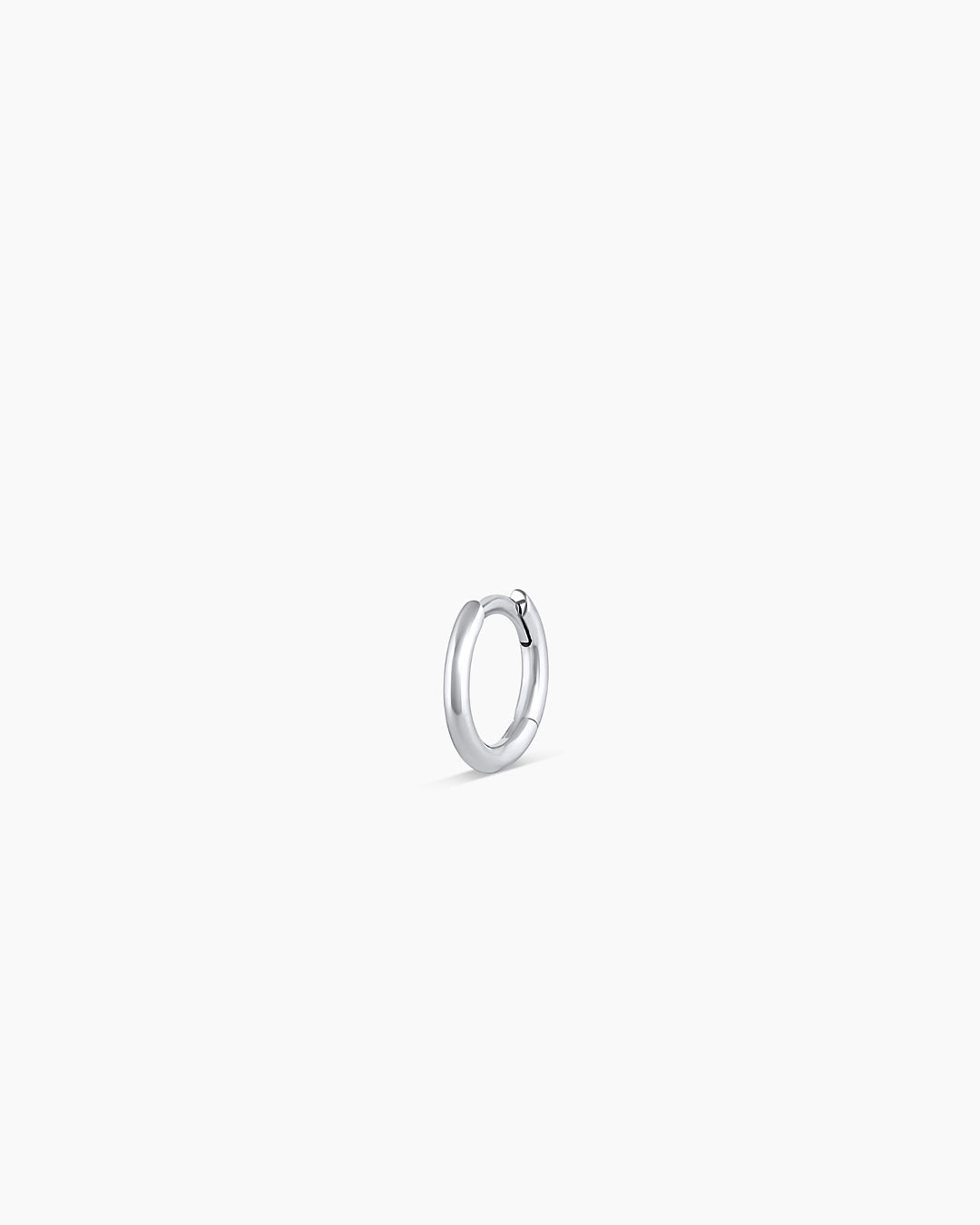 Woman wearing Classic Gold Huggie || option::14k Solid White Gold, 8mm