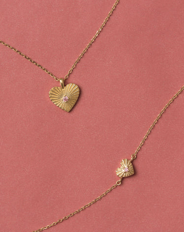 October BCRF products on a pink background