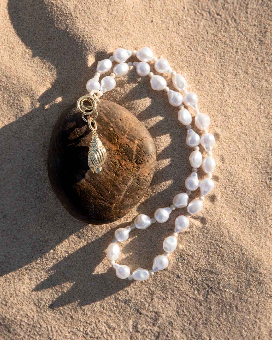 Pearl Necklace and shell charm. shop necklaces