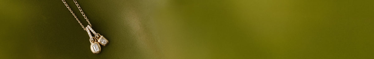 Lab Grown Diamond charms on a green background